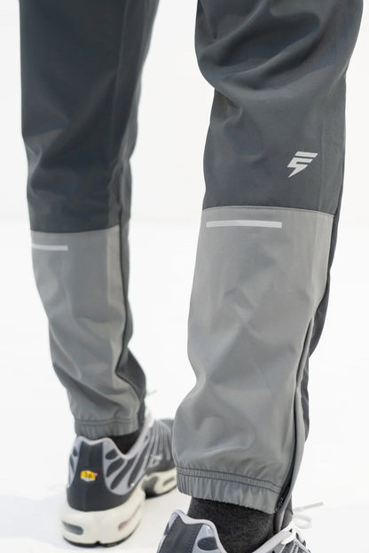 Elude track pants 'coal/light grey'